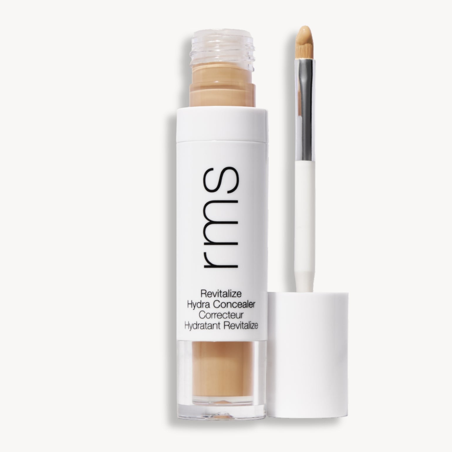 Flacon et applicateur du RMS Beauty Revitalize Hydra Concealer, Teinte W013. Anti-cernes liquide revitalisant pour une couvrance moyenne naturelle et lumineuse.