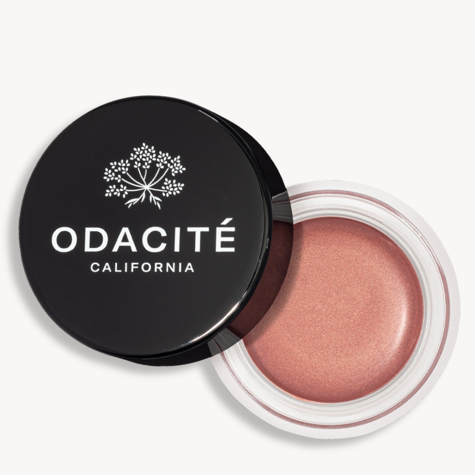 Pot ouvert de la teinte frosted petal du Baume teinté SPF50 Odacité avec le capuchon