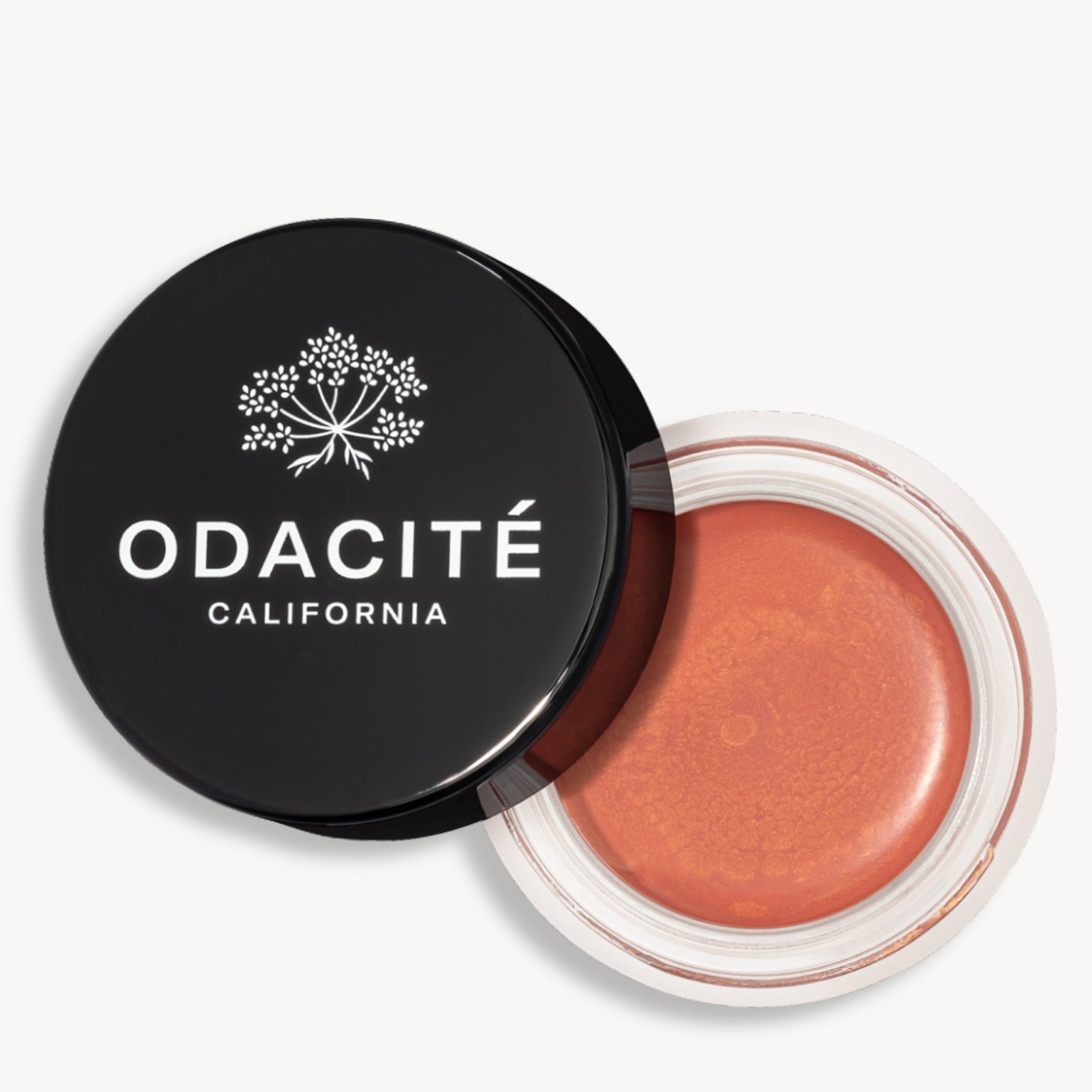 Pot ouvert de la teinte golden hour du Baume teinté SPF50 Odacité avec le capuchon